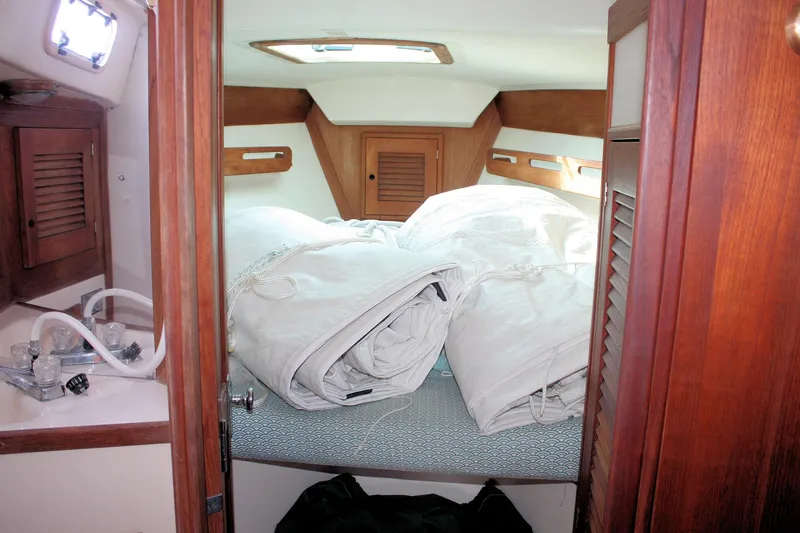 Slide: The Image of Cozy cabin interior of 1988 Tartan 34-2 Scheel Keel sailboat with bedding and wooden accents. - 17