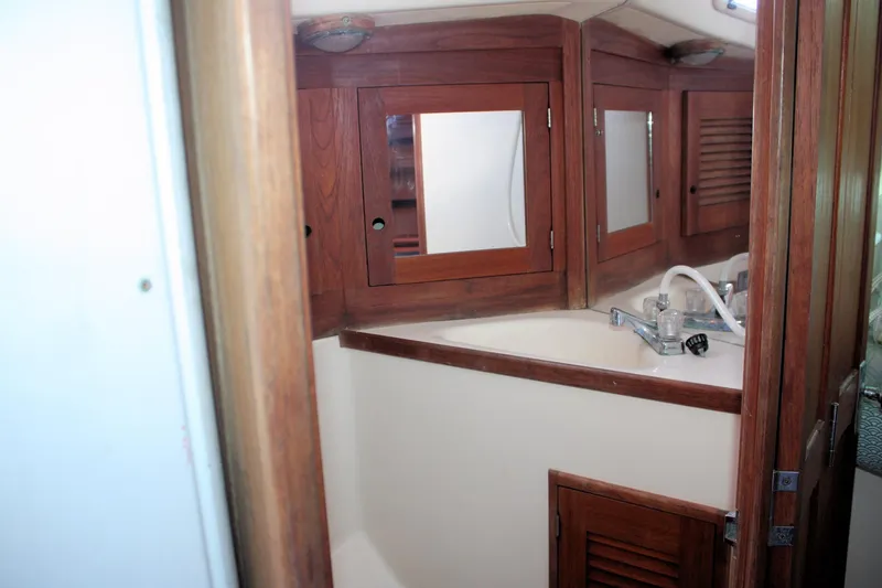 Slide: The Image of 1988 Tartan 34-2 Scheel Keel yacht interior with wooden cabinets and sink. - 19