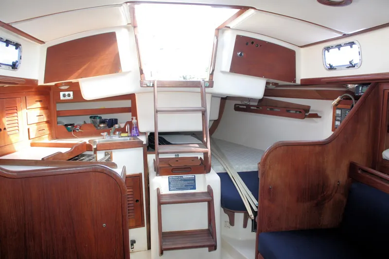 Slide: The Image of Interior of 1988 Tartan 34-2 Scheel Keel sailboat with wooden cabinetry and seating. - 24