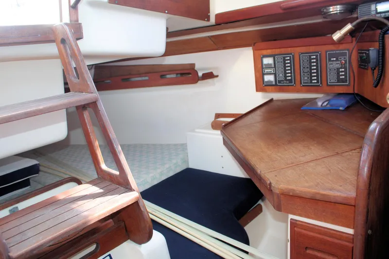 Slide: The Image of Interior of 1988 Tartan 34-2 Scheel Keel sailboat with wooden navigation station. - 30