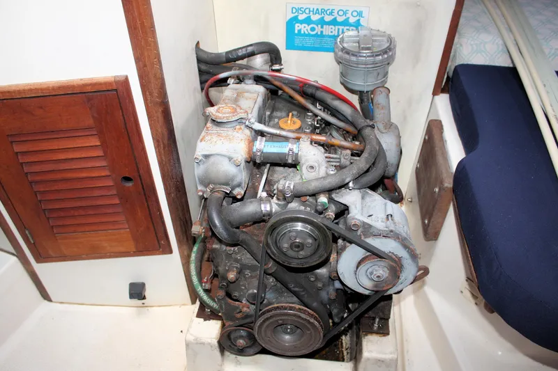 Slide: The Image of Engine compartment of a 1988 Tartan 34-2 Scheel Keel sailboat, showing mechanical components. - 31