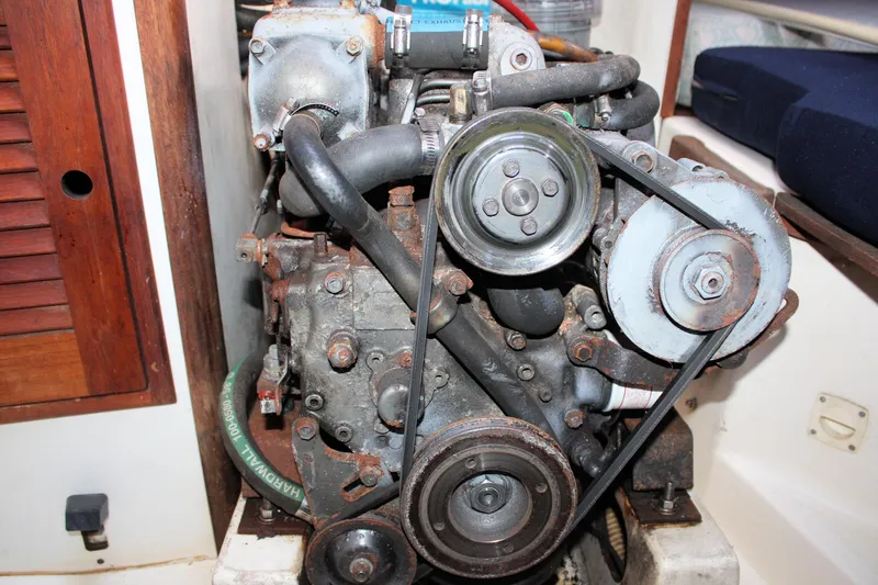 Slide: The Image of Engine of a 1988 Tartan 34-2 Scheel Keel sailboat, showing belts and pulleys. - 32