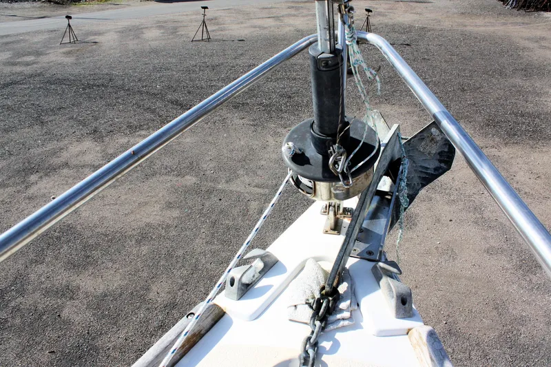 Slide: The Image of Bow of 1988 Tartan 34-2 Scheel Keel sailboat with metal fittings and winch. - 5