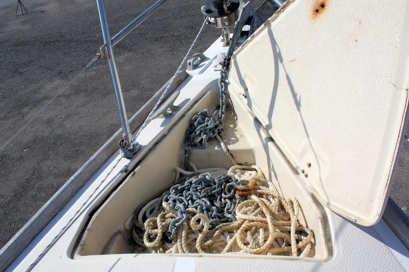 Slide: The Image of Anchor locker of 1988 Tartan 34-2 Scheel Keel with ropes and chains. - 6