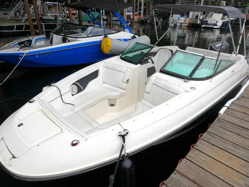 The Image of 2014 Sea Ray 240 Sundeck Outboard boat docked at marina. - 0