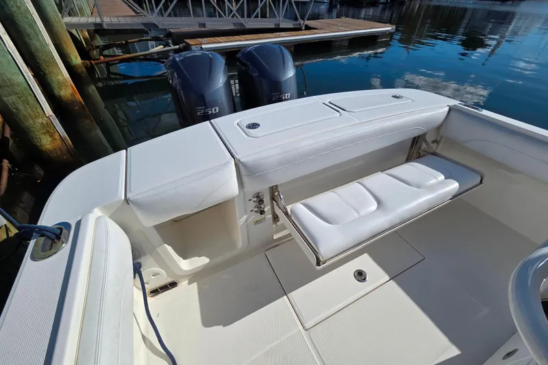 Slide: The Image of 2020 Regulator 25 boat with dual Yamaha 250 engines, docked with foldable seating. - 17