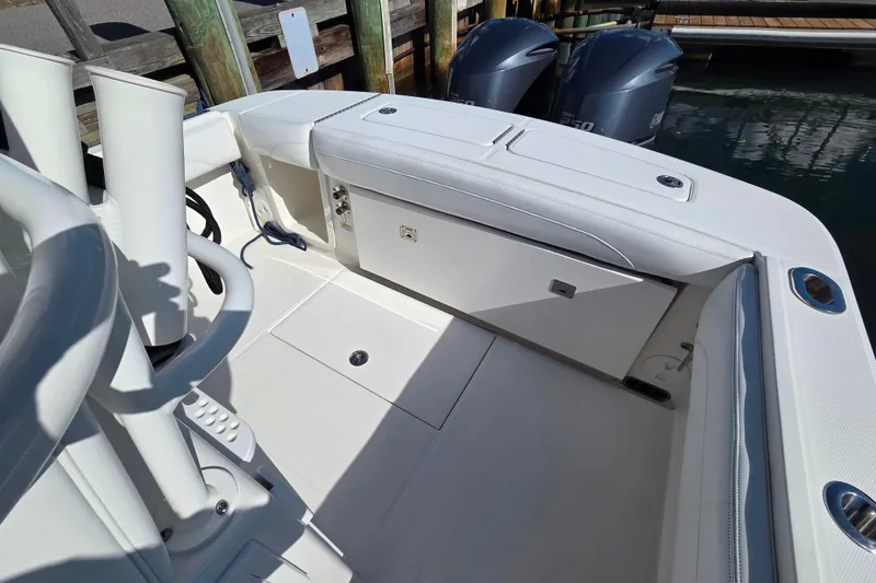 Slide: The Image of 2020 Regulator 25 boat interior with dual engines and seating area. - 18