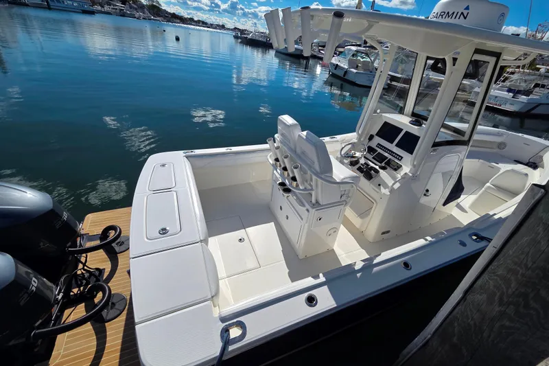 Slide: The Image of 2020 Regulator 25 boat docked with twin Yamaha 250 engines, featuring Garmin equipment. - 4