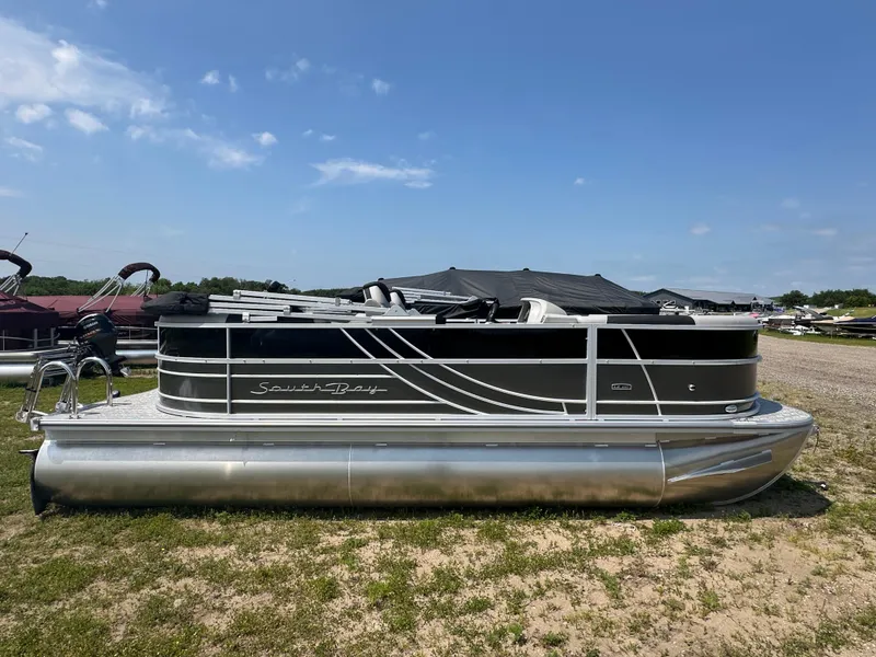The Image of 2025 South Bay 220RSLE pontoon boat on display outdoors. - 0