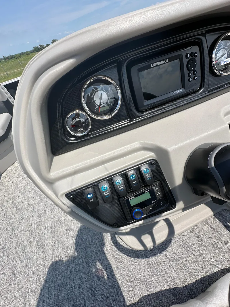 Slide: The Image of Dashboard of 2025 South Bay 220RSLE boat with gauges and Lowrance display. - 11