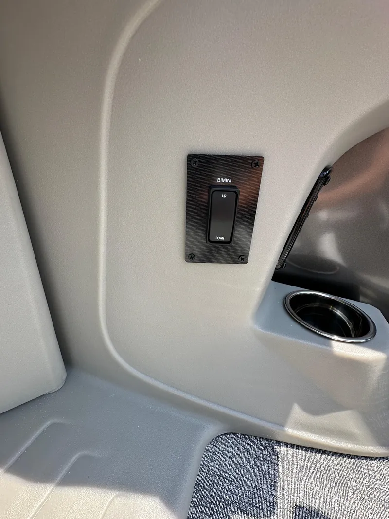 Slide: The Image of 2025 South Bay 220RSLE interior switch and cup holder. - 15