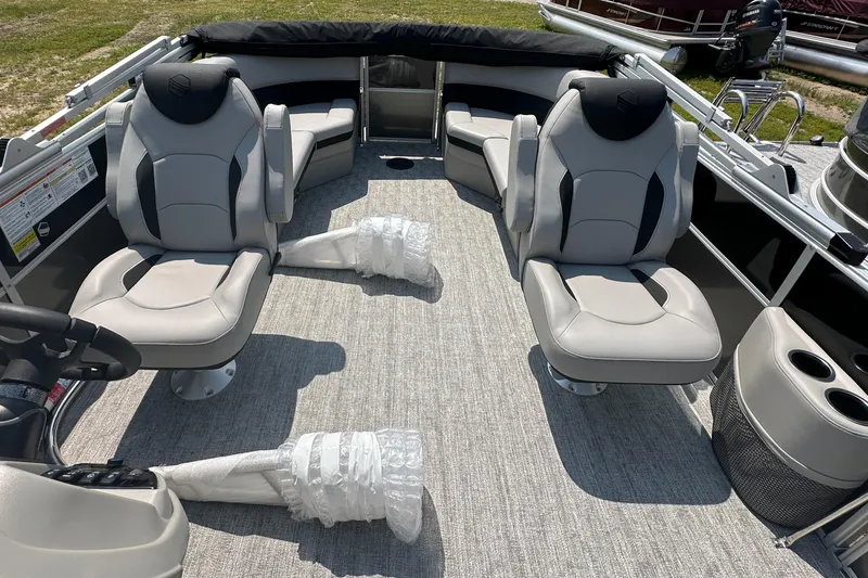 Slide: The Image of 2025 South Bay 220RSLE pontoon boat interior with plush seating and modern design. - 3