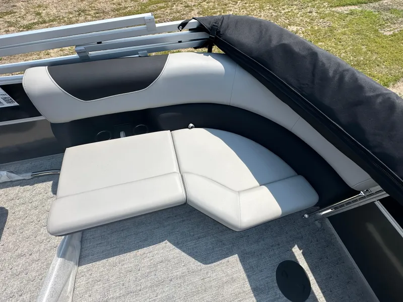 Slide: The Image of 2025 South Bay 220RSLE boat with gray and black seating. - 5