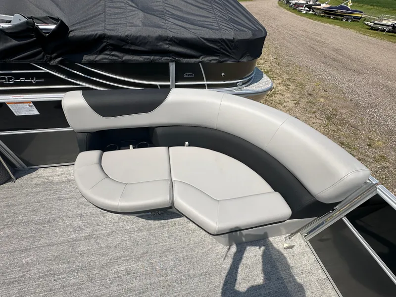 Slide: The Image of 2025 South Bay 220RSLE boat with gray and black seating on deck. - 7