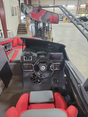 Slide: The Image of 2022 Axis Wake Research T23 boat interior with red and gray seating. - 6