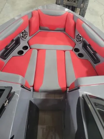 Slide: The Image of 2022 Axis Wake Research T23 boat interior with red and gray seating. - 8