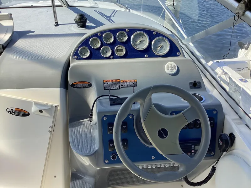Slide: The Image of 2004 Bayliner 2655 Ciera boat dashboard with steering wheel and instrument panel. - 8