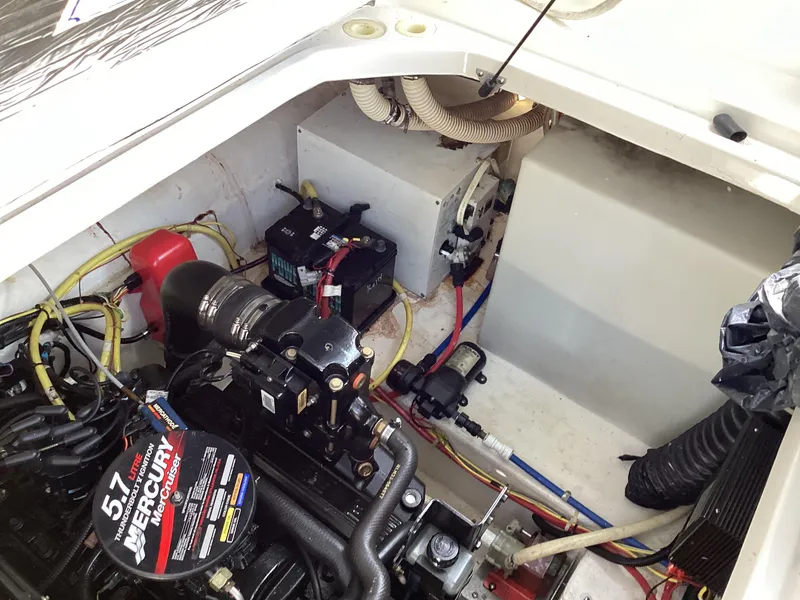 Slide: The Image of 2004 Bayliner 2655 Ciera engine compartment with 5.7L Mercury engine. - 15