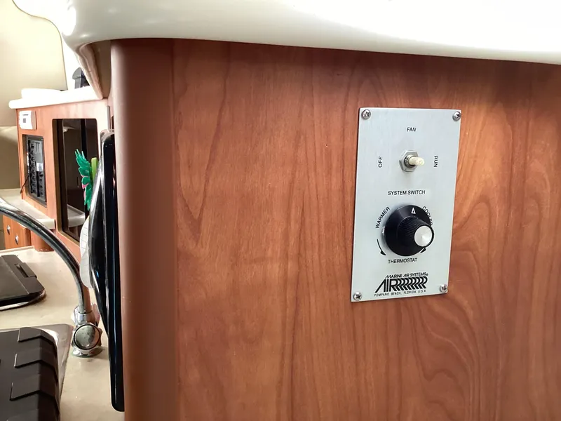Slide: The Image of Control panel on 2004 Bayliner 2655 Ciera boat with wood finish. - 25