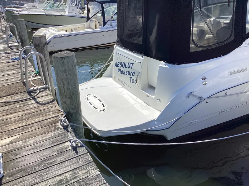 Slide: The Image of 2004 Bayliner 2655 Ciera docked at a marina. - 2