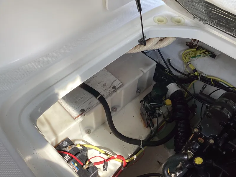 Slide: The Image of Engine compartment of a 2004 Bayliner 2655 Ciera boat showing wiring and battery. - 16