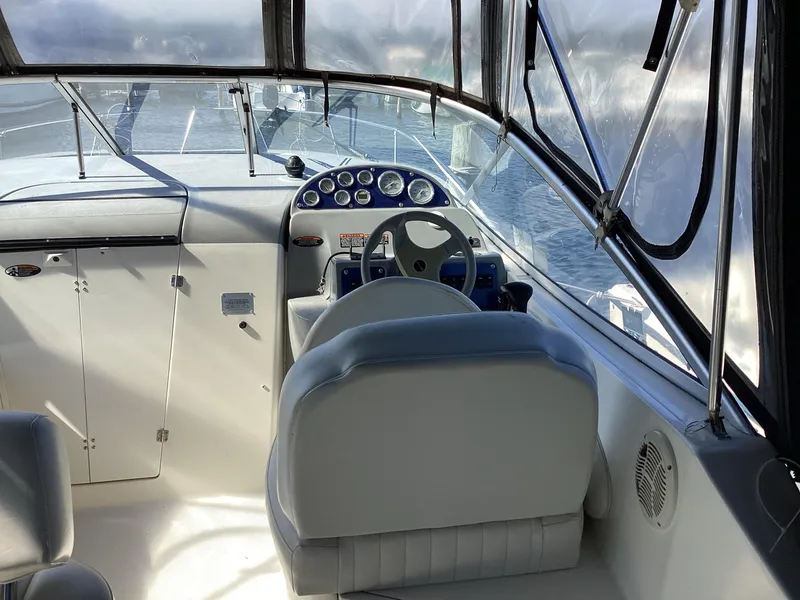 Slide: The Image of 2004 Bayliner 2655 Ciera boat cockpit with steering wheel and dashboard. - 7