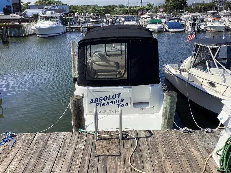 Slide: The Image of 2004 Bayliner 2655 Ciera docked at marina, rear view with Absolut Pleasure Too name. - 4