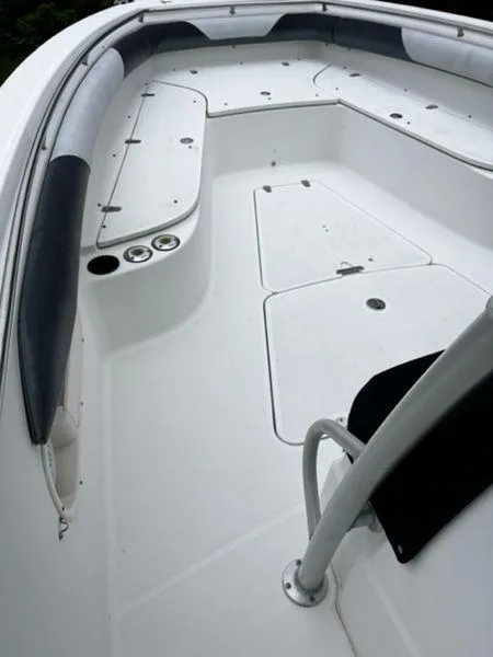 Slide: The Image of 2004 Boston Whaler 320 Outrage boat deck with storage compartments and seating. - 13