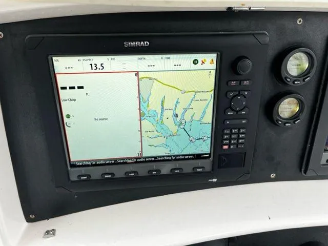 Slide: The Image of Simrad navigation system on a 2004 Boston Whaler 320 Outrage boat. - 16