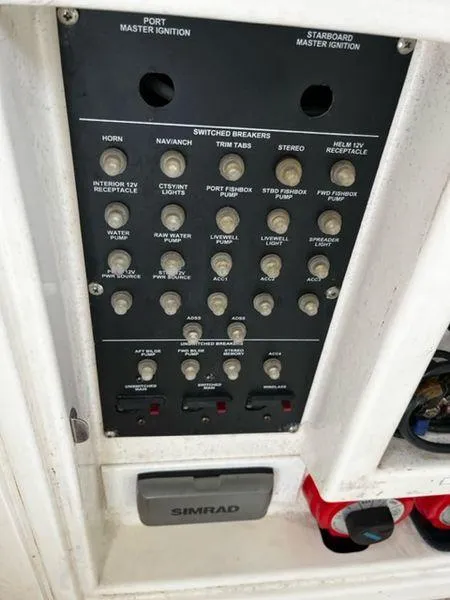 Slide: The Image of Control panel of a 2004 Boston Whaler 320 Outrage boat. - 27