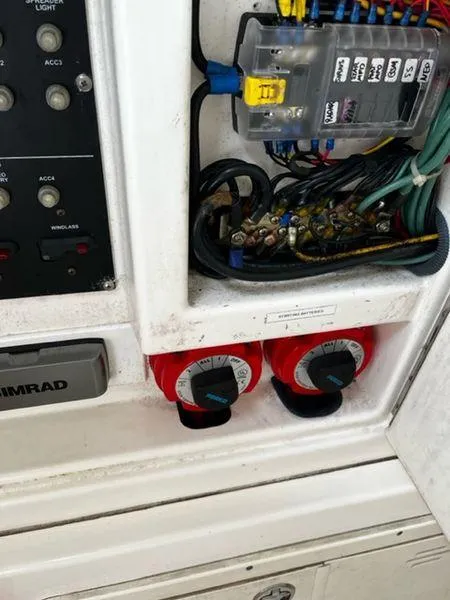 Slide: The Image of Electrical panel and switches on a 2004 Boston Whaler 320 Outrage boat. - 29