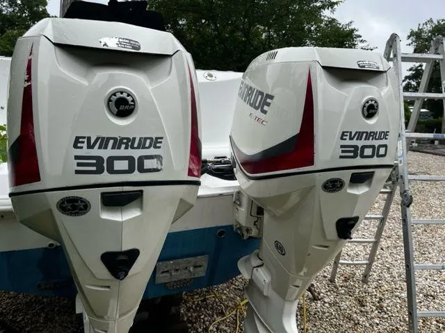 Slide: The Image of 2004 Boston Whaler 320 Outrage with twin Evinrude 300 outboard engines. - 32