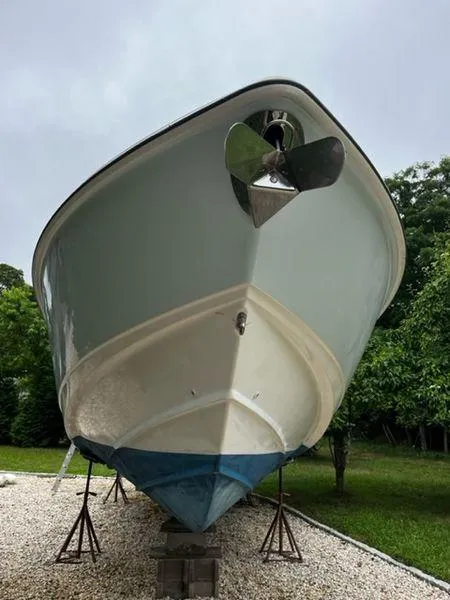 Slide: The Image of 2004 Boston Whaler 320 Outrage boat on stands, front view. - 9