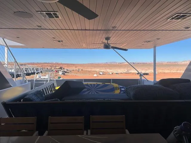 Slide: The Image of Luxurious Adonia Ovation yacht deck with scenic desert view, 2023 model. - 12