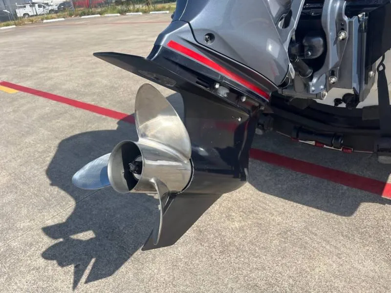 Slide: The Image of Close-up of 2016 Skeeter ZX 250 boat propeller on concrete surface. - 12