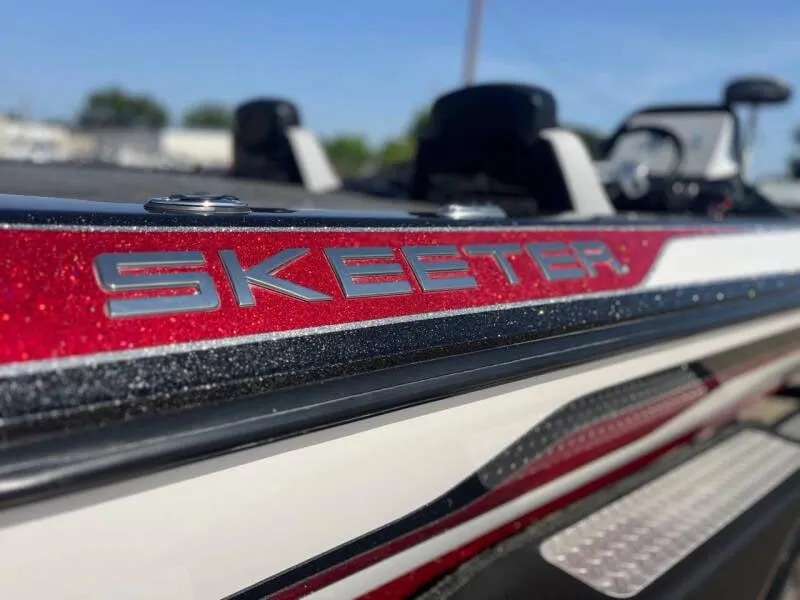 Slide: The Image of Close-up of 2016 Skeeter ZX 250 boat with red and white detailing. - 15