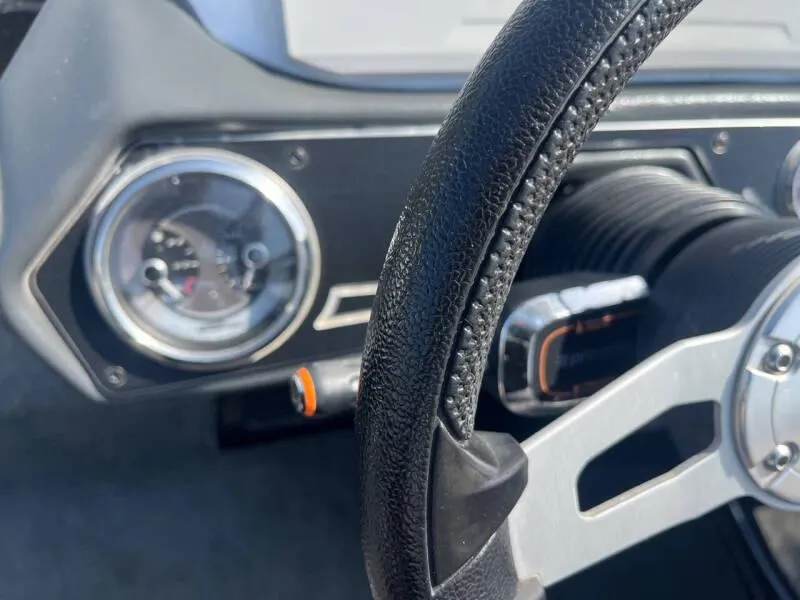 Slide: The Image of Close-up of 2016 Skeeter ZX 250 boat dashboard and steering wheel. - 22