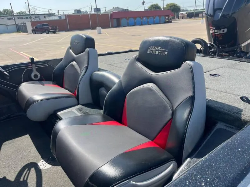Slide: The Image of 2016 Skeeter ZX 250 boat interior with dual seats in parking lot. - 23