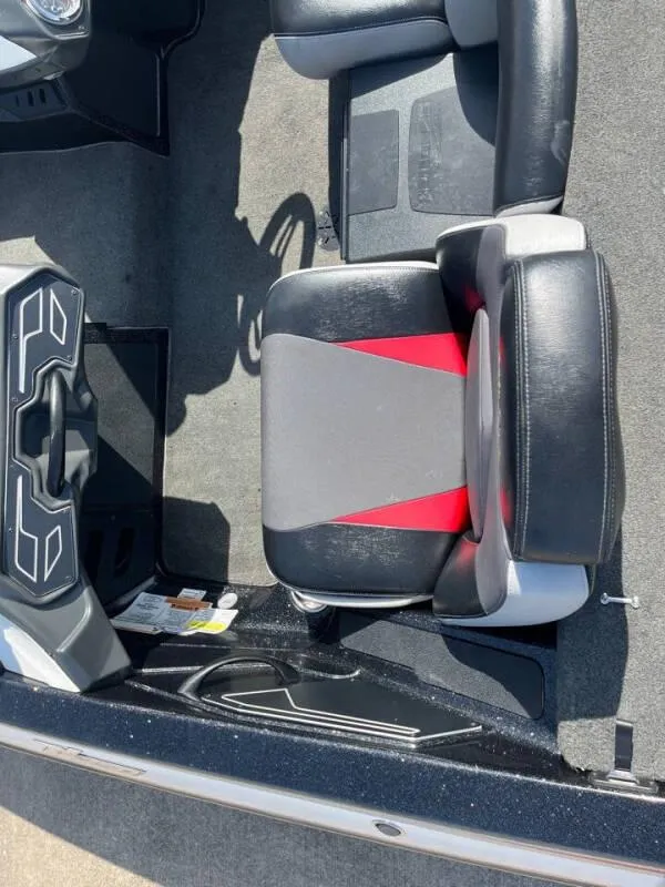 Slide: The Image of 2016 Skeeter ZX 250 boat interior with black and red seating. - 24