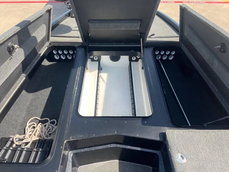 Slide: The Image of 2016 Skeeter ZX 250 boat storage compartments and rod holders. - 27