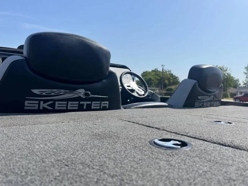 Slide: The Image of 2016 Skeeter ZX 250 boat interior with logo and dashboard. - 33