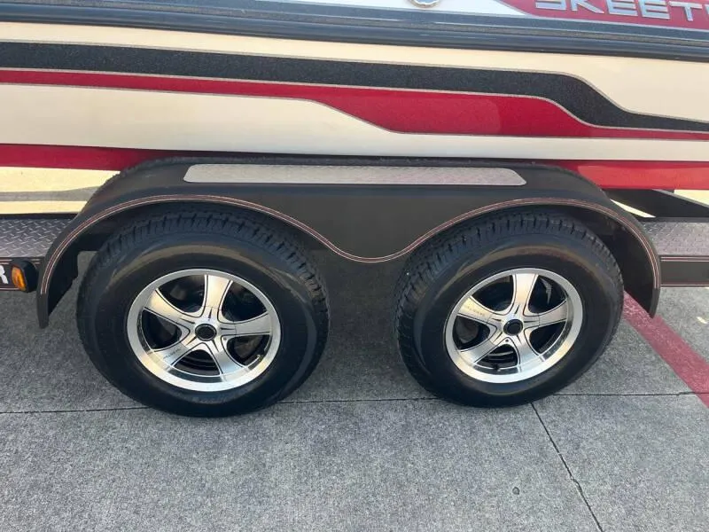 Slide: The Image of 2016 Skeeter ZX 250 boat trailer with dual wheels and chrome rims. - 34