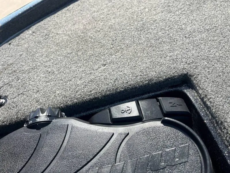 Slide: The Image of Close-up of 2016 Skeeter ZX 250 boat's foot pedal and control buttons. - 37