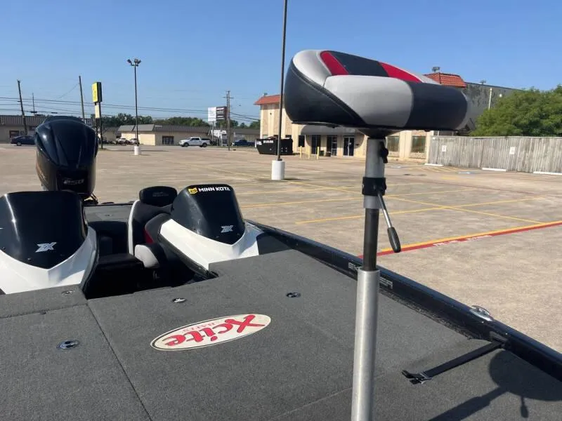 Slide: The Image of 2016 Skeeter ZX 250 bass boat with elevated seat in parking lot. - 43