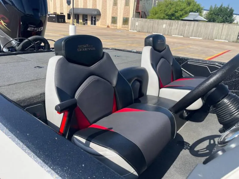 Slide: The Image of 2016 Skeeter ZX 250 boat interior with dual seats and steering wheel. - 47