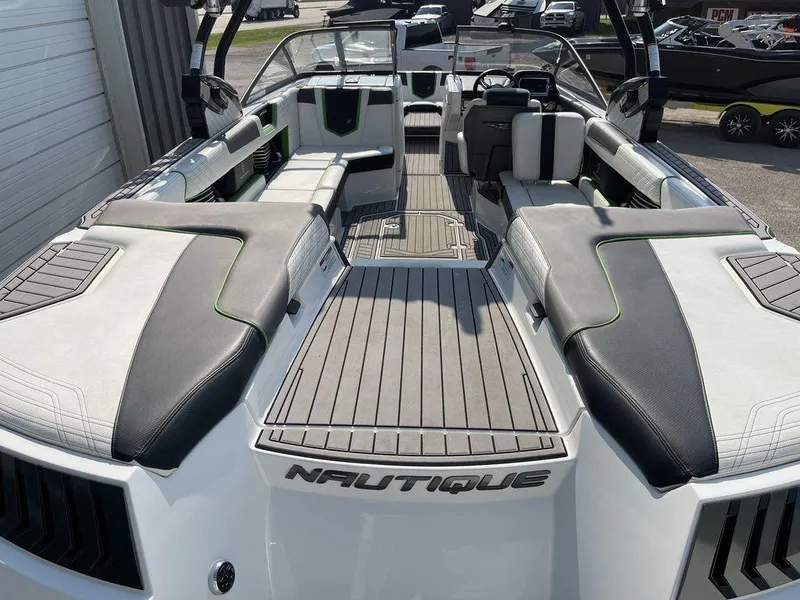 Slide: The Image of 2016 Nautique G25 boat interior with spacious seating and modern design. - 3