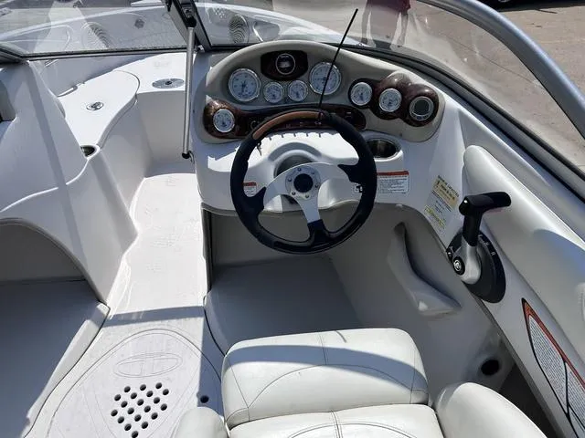 Slide: The Image of 2015 Tahoe Q7i boat dashboard and steering wheel with gauges and controls. - 5