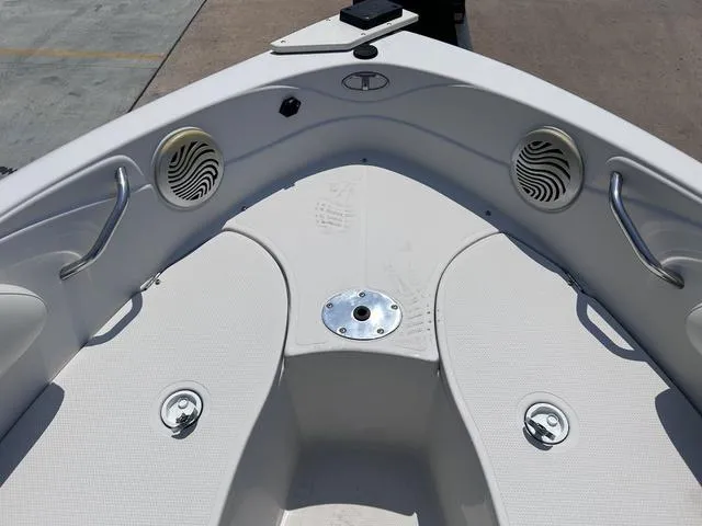 Slide: The Image of 2015 Tahoe Q7i boat bow seating area with speakers and cup holders. - 6