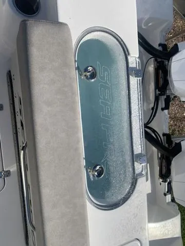 Slide: The Image of 2024 Sea Pro 262 CC boat livewell with logo, featuring sleek design and modern fittings. - 16