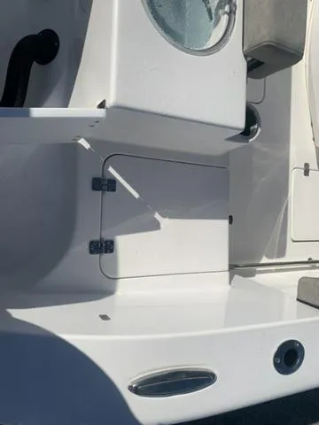 Slide: The Image of 2024 Sea Pro 262 CC boat interior detail with storage compartment and sleek design. - 17